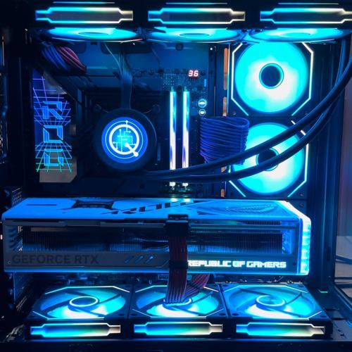 Blue-lit custom PC with Q-logo fans and a Republic of Gamers graphics card