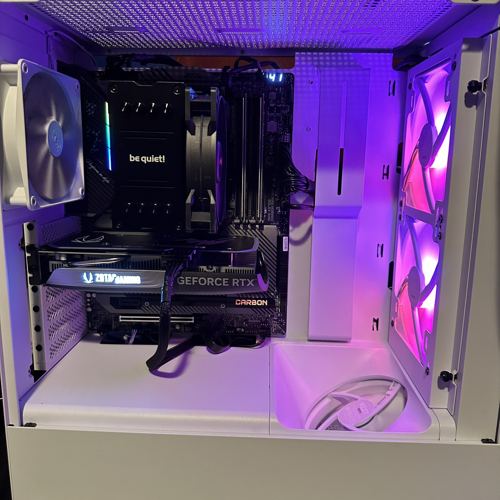 White PC with purple lighting, air cooler and graphics card